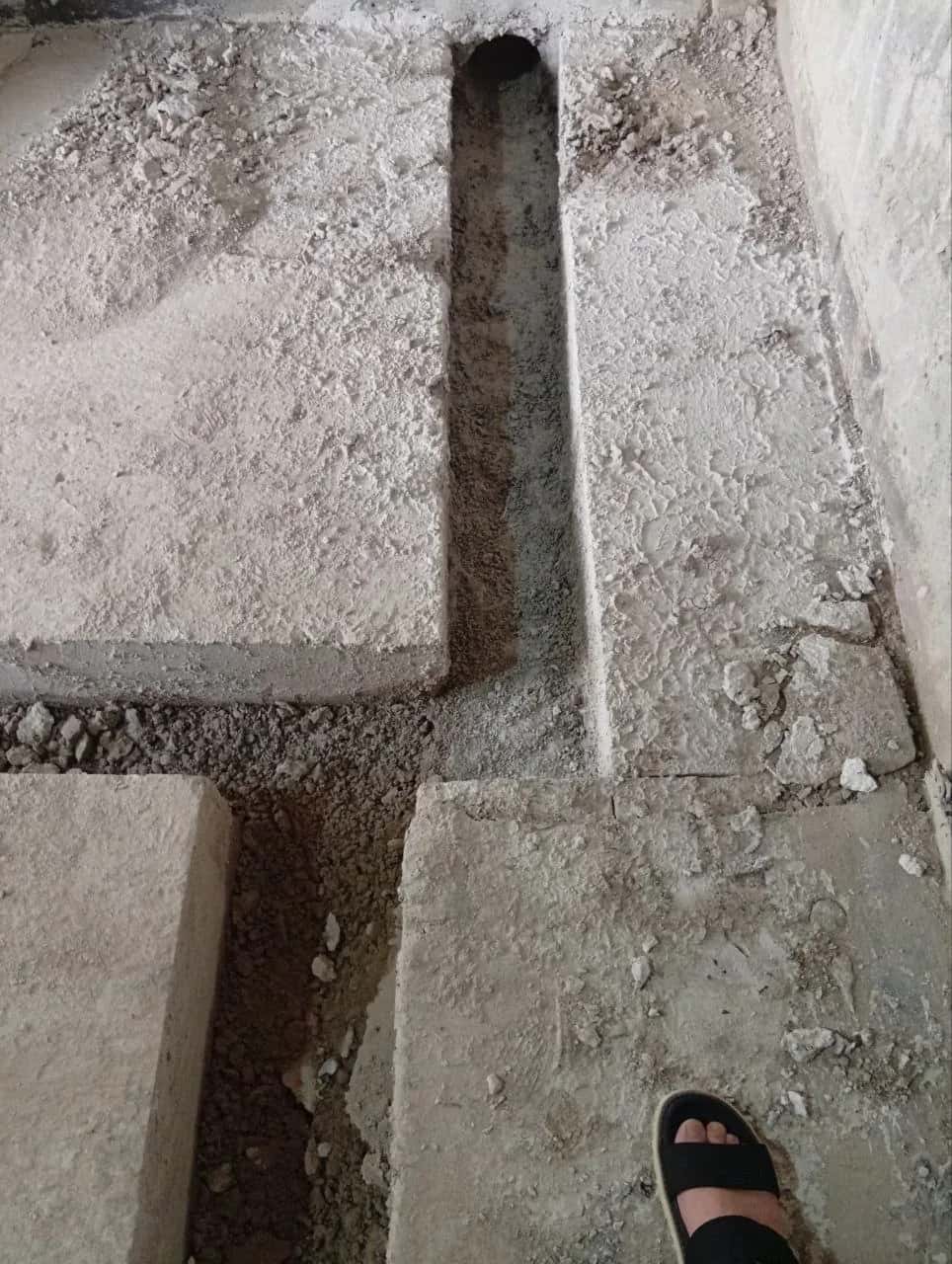 Service channel cut into a concrete floor